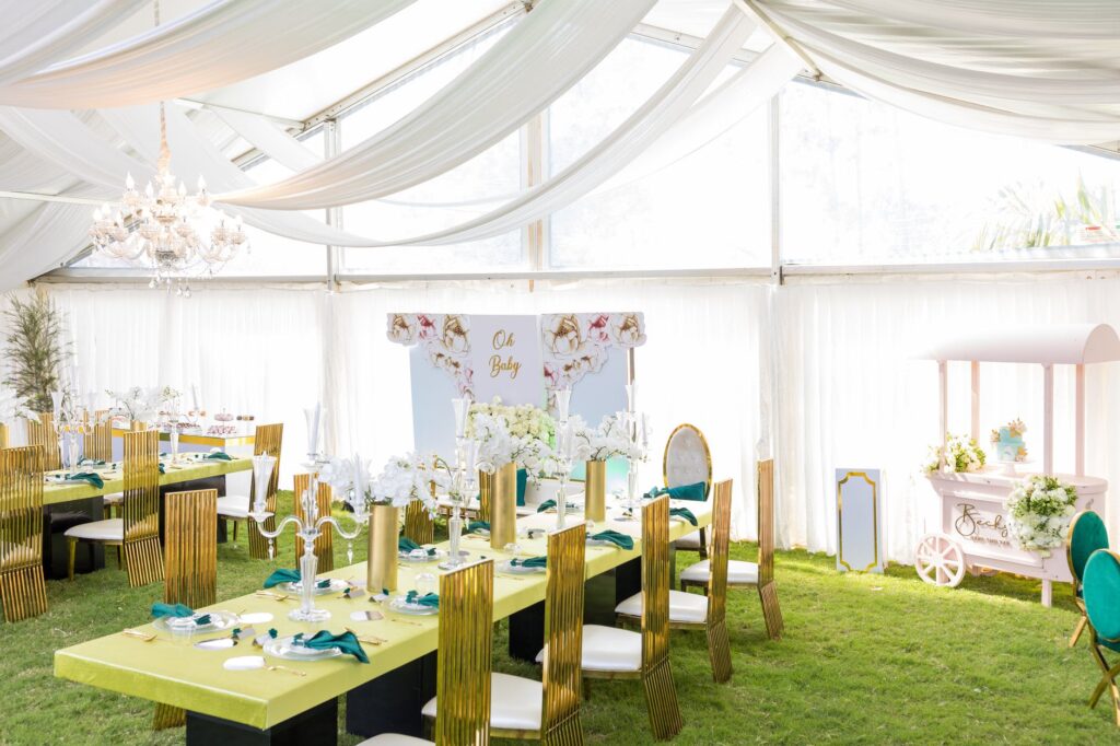 dining tables and chairs setting under white fabric canopies